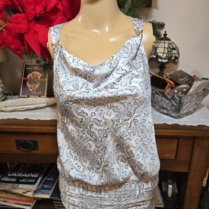 White House Black Market Sleeveless Blouse with Patterned Design.